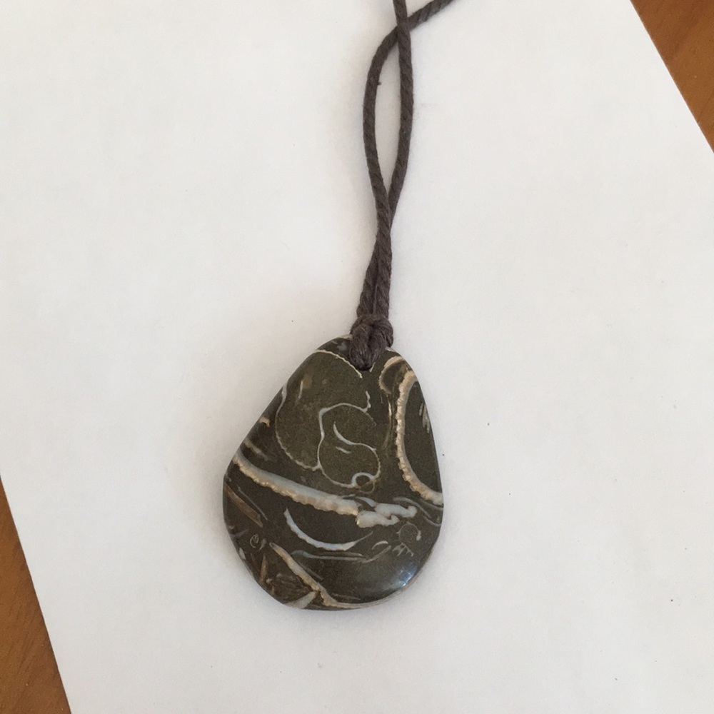 Polished stone with shells pendant